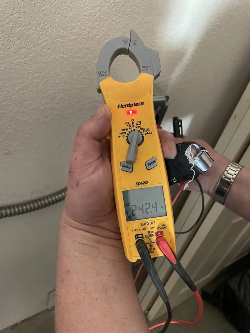 Voltage testing with clamp meter during Recessed Lighting Installation in West Haverstraw